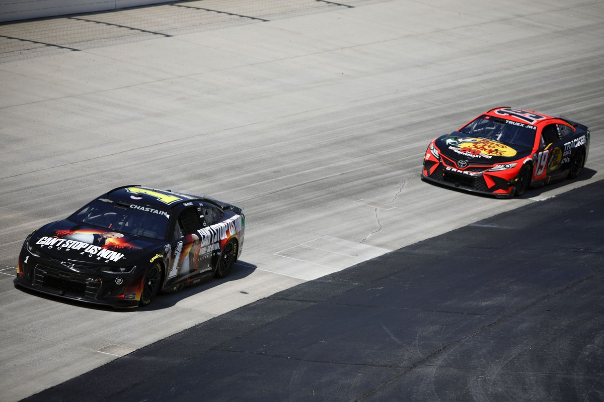 Ross Chastain, driver of the #1 Pitbull Tour 2022 Chevrolet, and Martin Truex Jr., driver of the #19 Bass Pro Shops Toyota, race during the NASCAR Cup Series DuraMAX Drydene 400 presented by RelaDyne at Dover Motor Speedway on May 02, 2022 in Dover, Delaware.