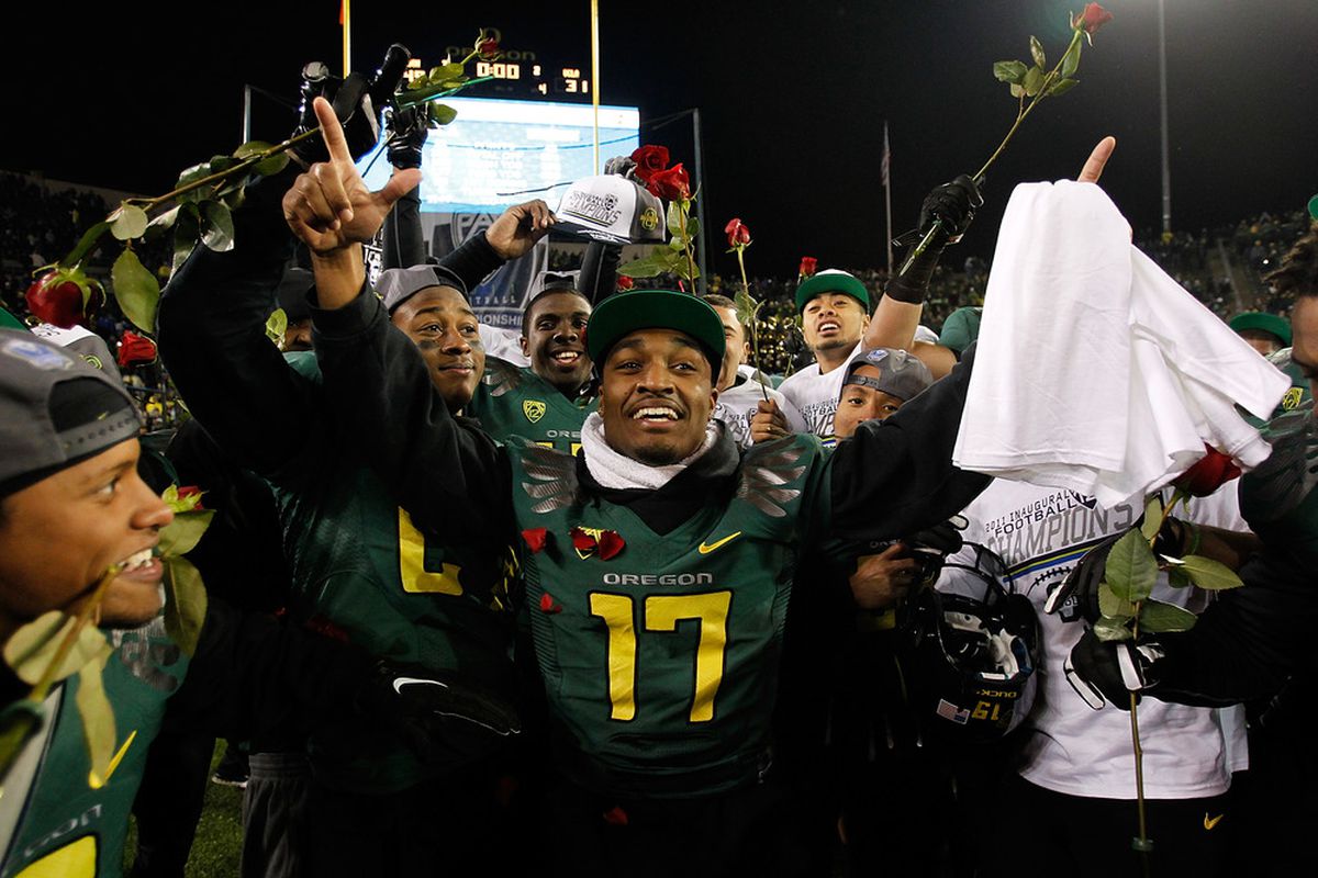 EUGENE, OR - DECEMBER 02: Players celebrate the Oregon Ducks 49-31 victory over  the UCLA Bruins during the Pac 12 Championship Game on December 2, 2011 at the Autzen Stadium in Eugene, Oregon.  (Photo by Jonathan Ferrey/Getty Images)