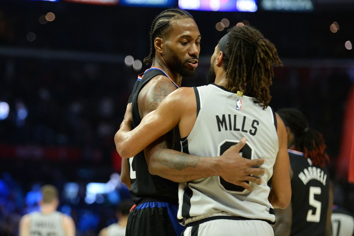 Los Angeles Clippers forward Kawhi Leonard meets with San Antonio Spurs guard Patty Mills following the 103-97 victory at Staples Center.&nbsp;