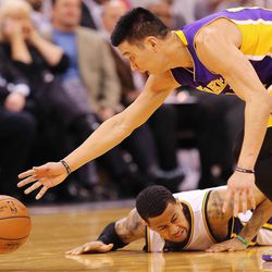 Utah Jazz guard Trey Burke (3) dives after the ball as Los Angeles Lakers guard Jeremy Lin (17) picks it up as the Jazz and the Lakers play Wednesday, Feb. 25, 2015, at EnergySolutions Arena in Salt Lake City.