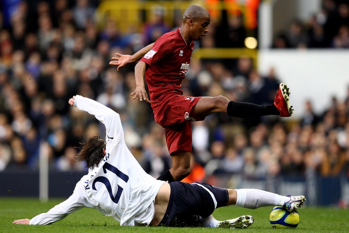 Sido Jombati of Cheltenham is tackled by Niko Kranjcar of Spurs during the FA Cup Third Rund match between Tottenham Hotspur and Cheltenham Town at White Hart Lane on January 7, 2012.