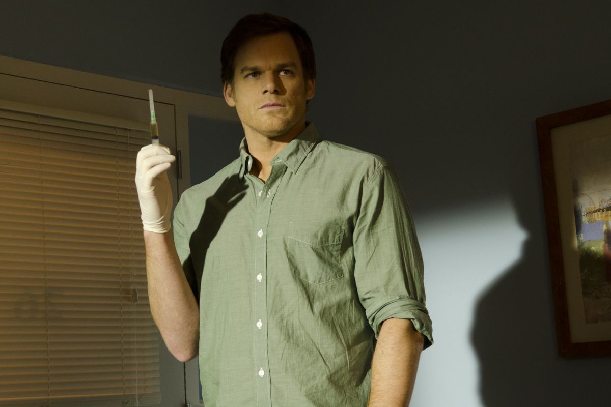 Dexter holding a syringe in Dexter season 8