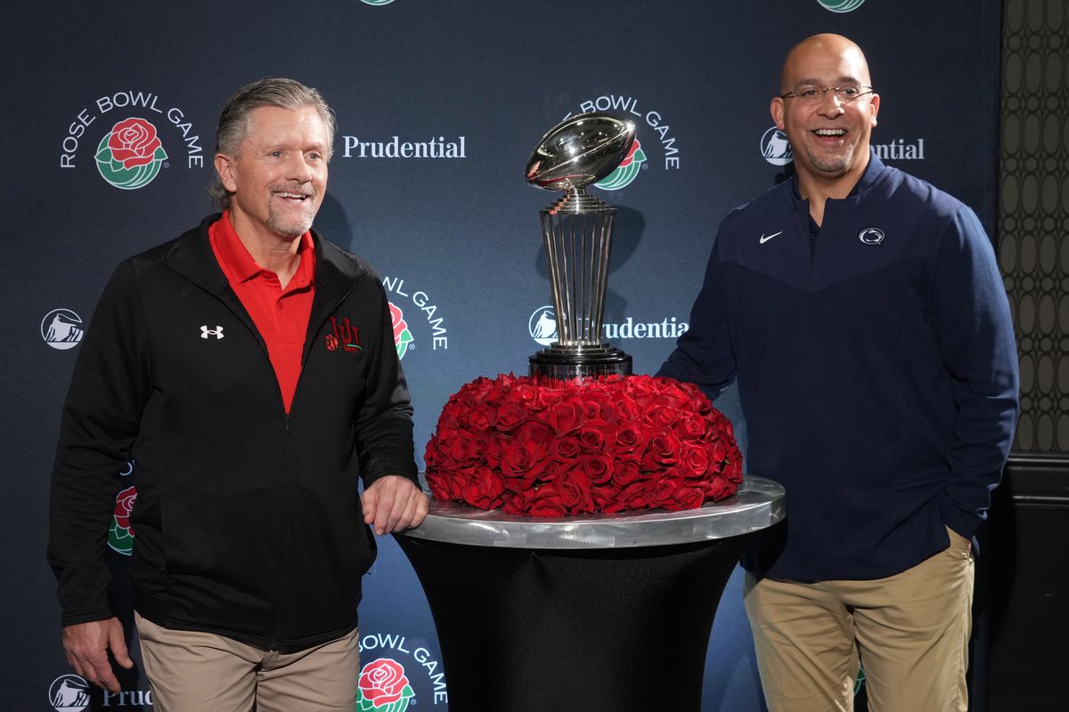 Jan 1, 2023; Los Angeles, California, USA; Utah Utes coach Kyle Whittingham (left) and Penn State Nittany Lions coach James Franklin pose with the Leishman Trophy during the Rose Bowl coaches press conference at the Sheraton Grand Los Angeles.
