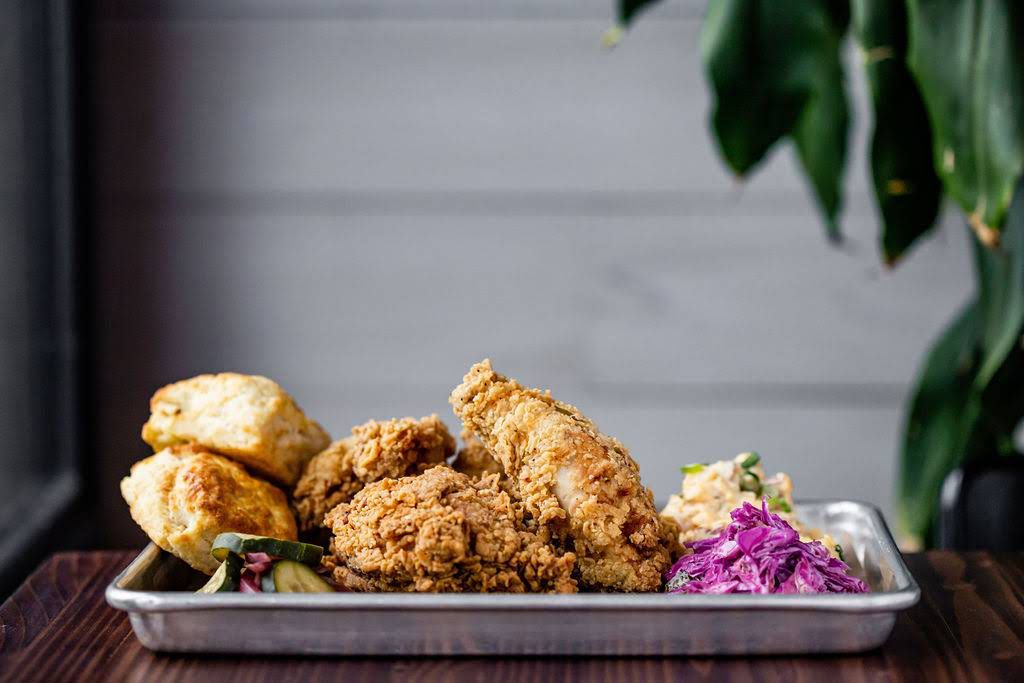 A tray of fried chicken and biscuits from FM Kitchen and Bar in Houston. 