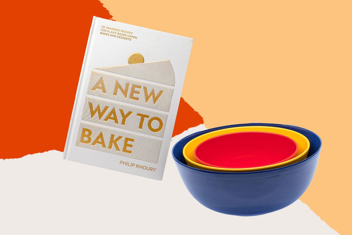 The cookbook “A New Way to Bake” and a set of stacked bowls