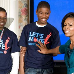 First lady Michelle Obama, with members of the 2009 National Championship Pee-Wee football team, talks about her "Let's Move" initiative Tuesday at the White House.       