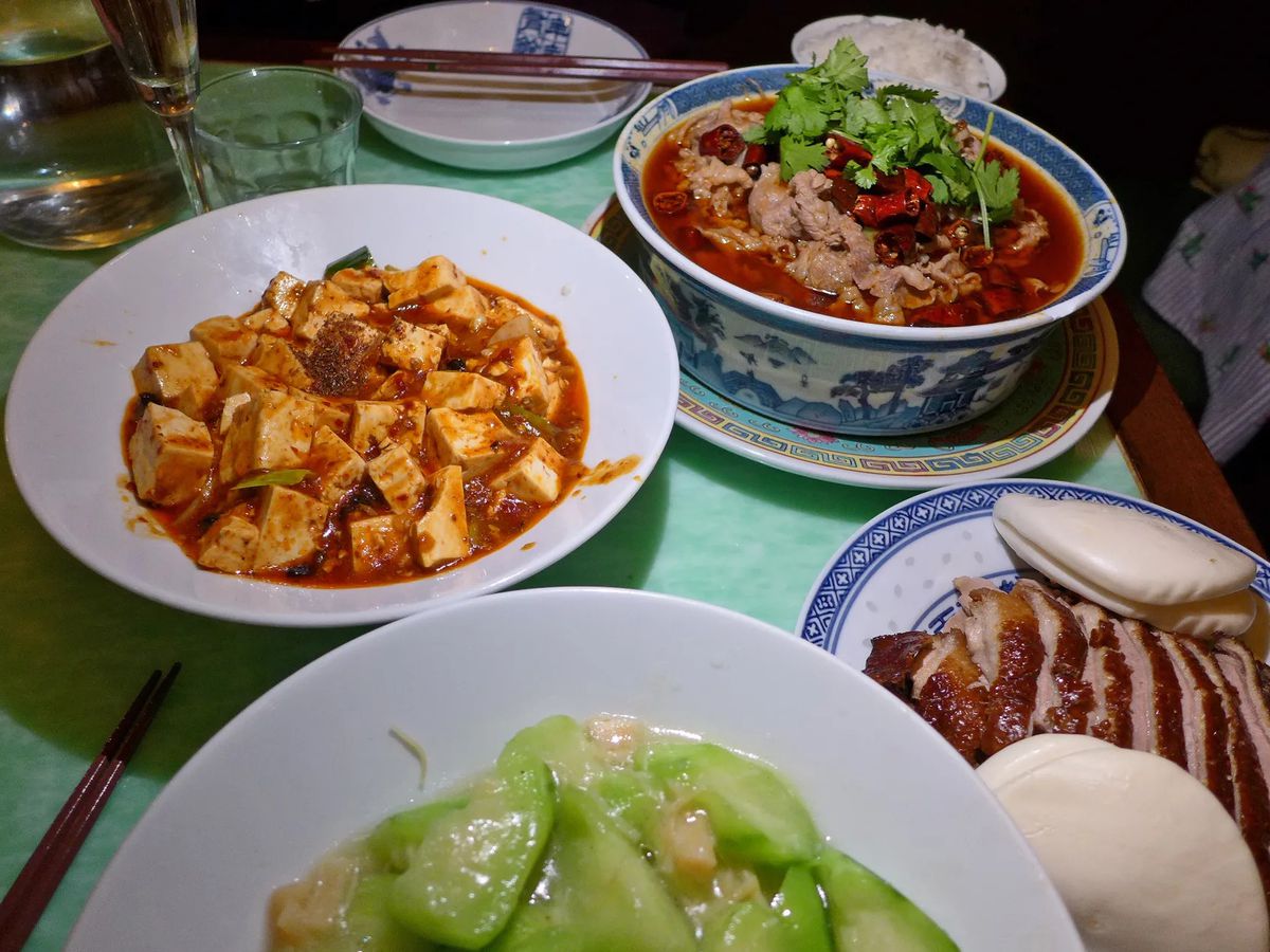 A spread from Cafe China, including melon and ma po tofu.