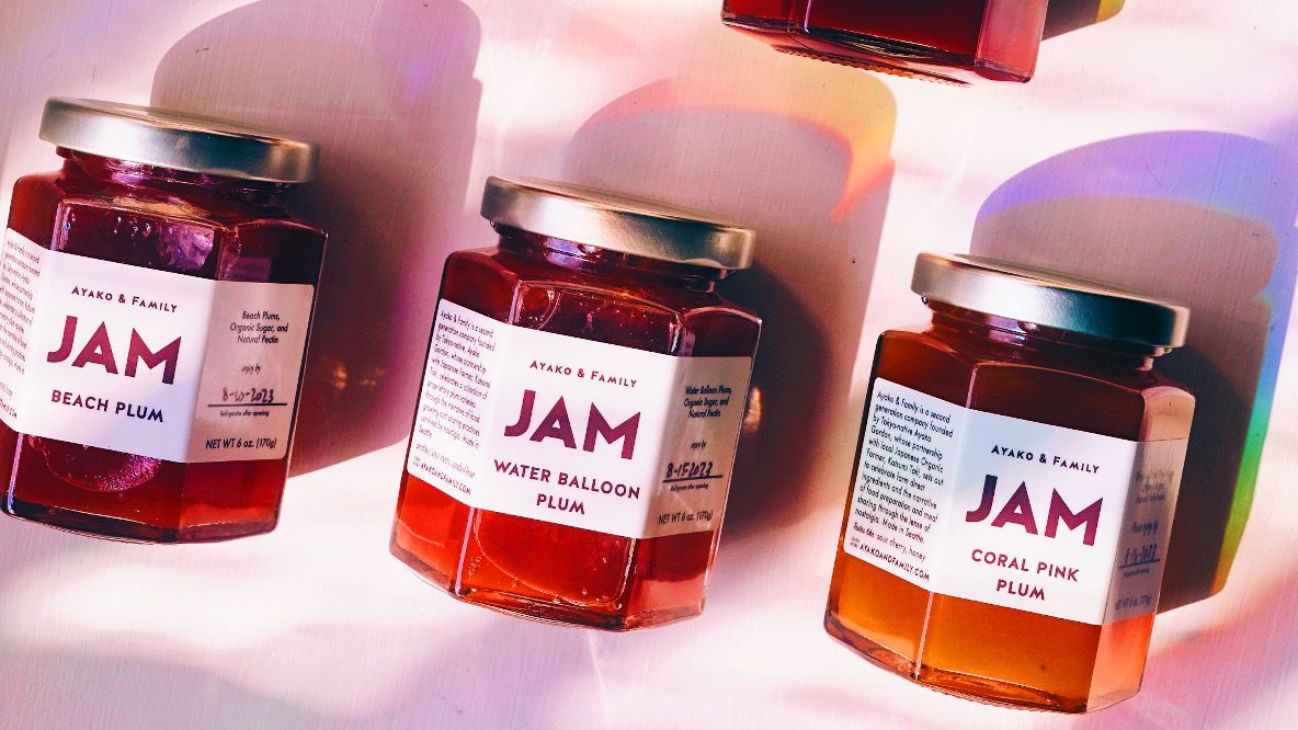 A trio of small plum jam jars with Ayako &amp; Family labels.
