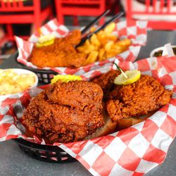 <a href="http://www.eater.com/2014/10/8/6948677/nashville-hot-chicken">Hattie B's in Nashville: Hot chicken with pimento mac and cheese and greens.</a>
