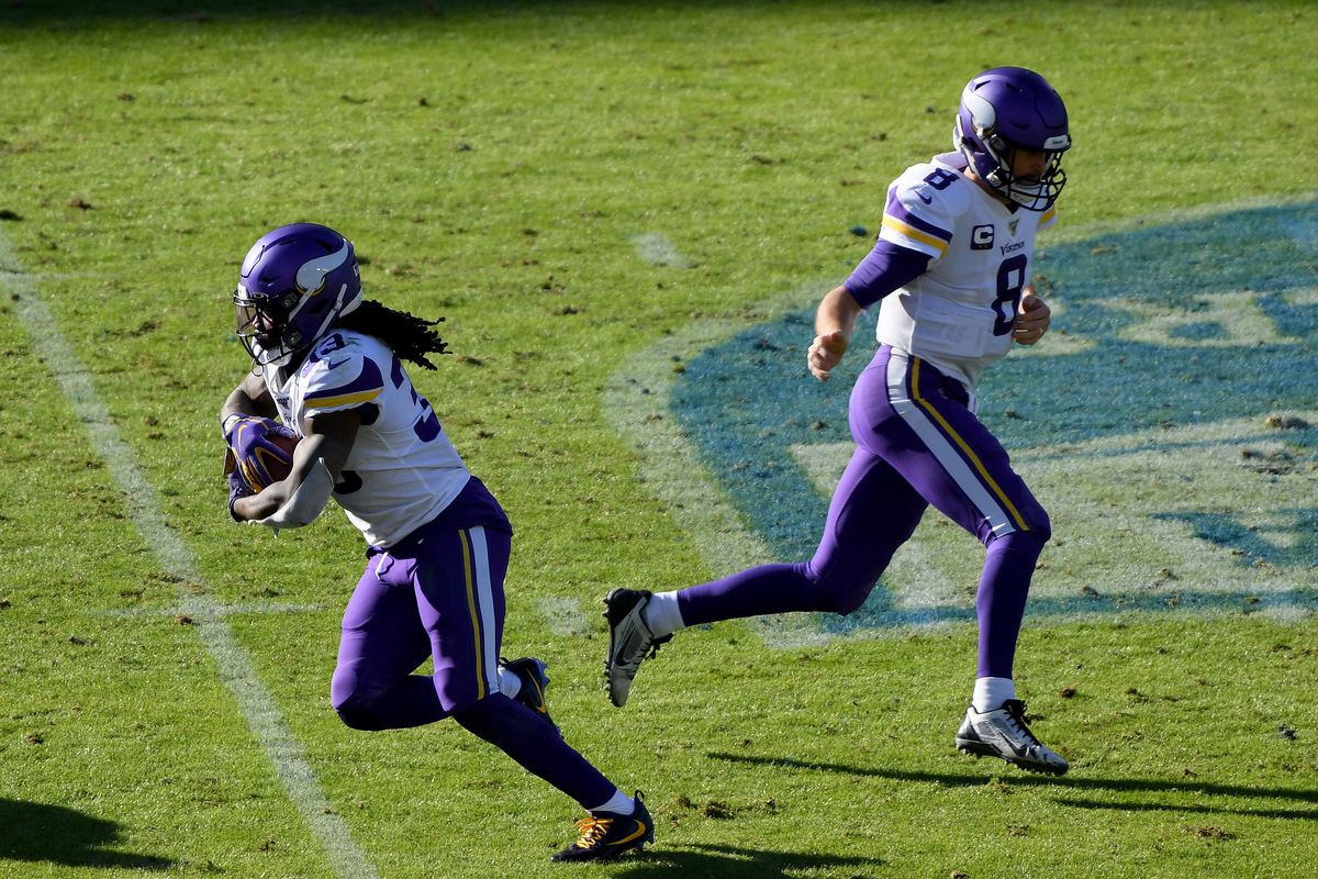 Dalvin Cook of the Minnesota Vikings takes a handoff from Kirk Cousins during the second quarter against the Los Angeles Chargers at Dignity Health Sports Park on December 15, 2019 in Carson, California.
