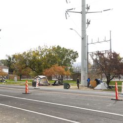 Tents belonging to homeless people line the less crowded side of 700 South in Salt Lake City on Friday, Oct. 23, 2020.