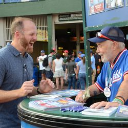 Tue 5:53 p.m. Ryan Dempter enjoying a laugh with scorecard vendor Walter, outside of Gate D - 