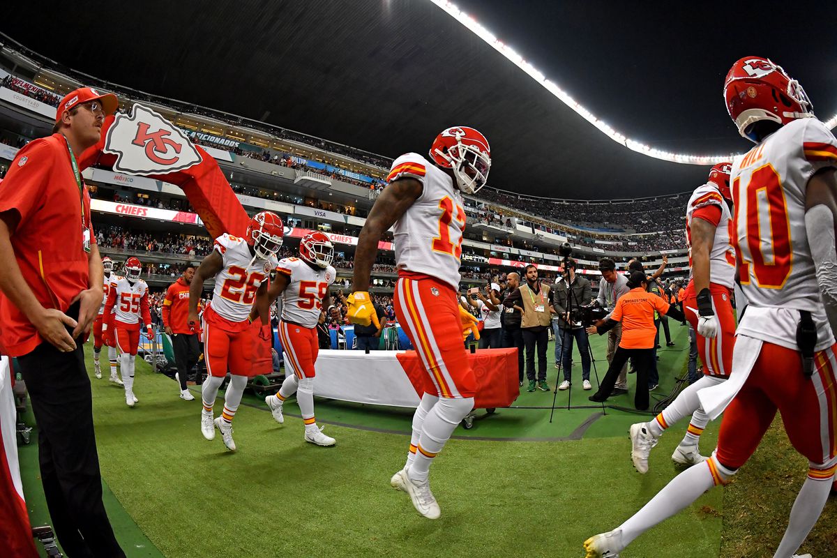 Byron Pringle of the Kansas City Chiefs, Tyreek Hill, Damien Williams, and Reggie Ragland enter field before an NFL football game against the Los Angeles Chargers on Monday, November 18, 2019, in Mexico City.