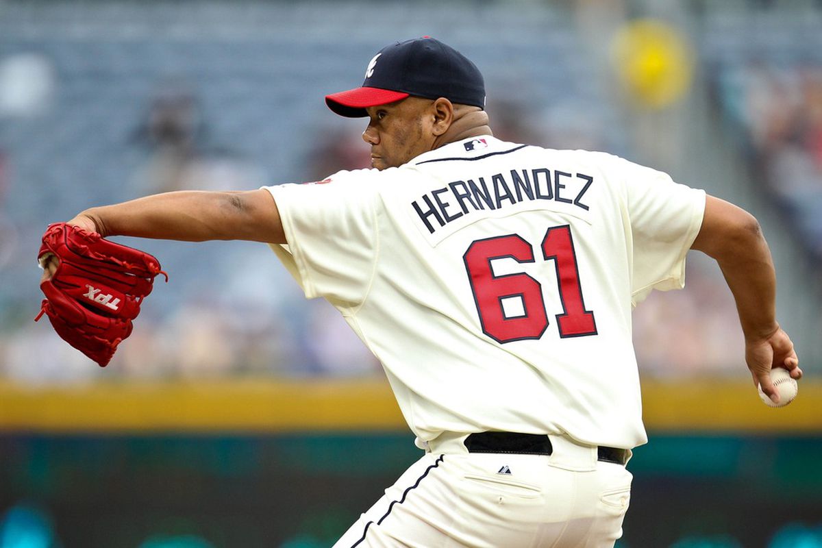 June 10, 2012; Atlanta, GA, USA; Atlanta Braves relief pitcher Livan Hernandez (61) pitches in the fifth inning of the game against the Toronto Blue Jays at Turner Field. Mandatory Credit: Daniel Shirey-US PRESSWIRE