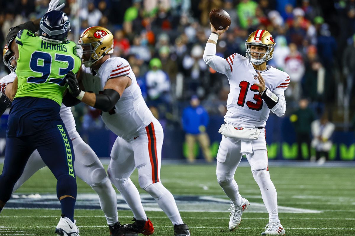 San Francisco 49ers quarterback Brock Purdy (13) passes against the Seattle Seahawks during the fourth quarter at Lumen Field.