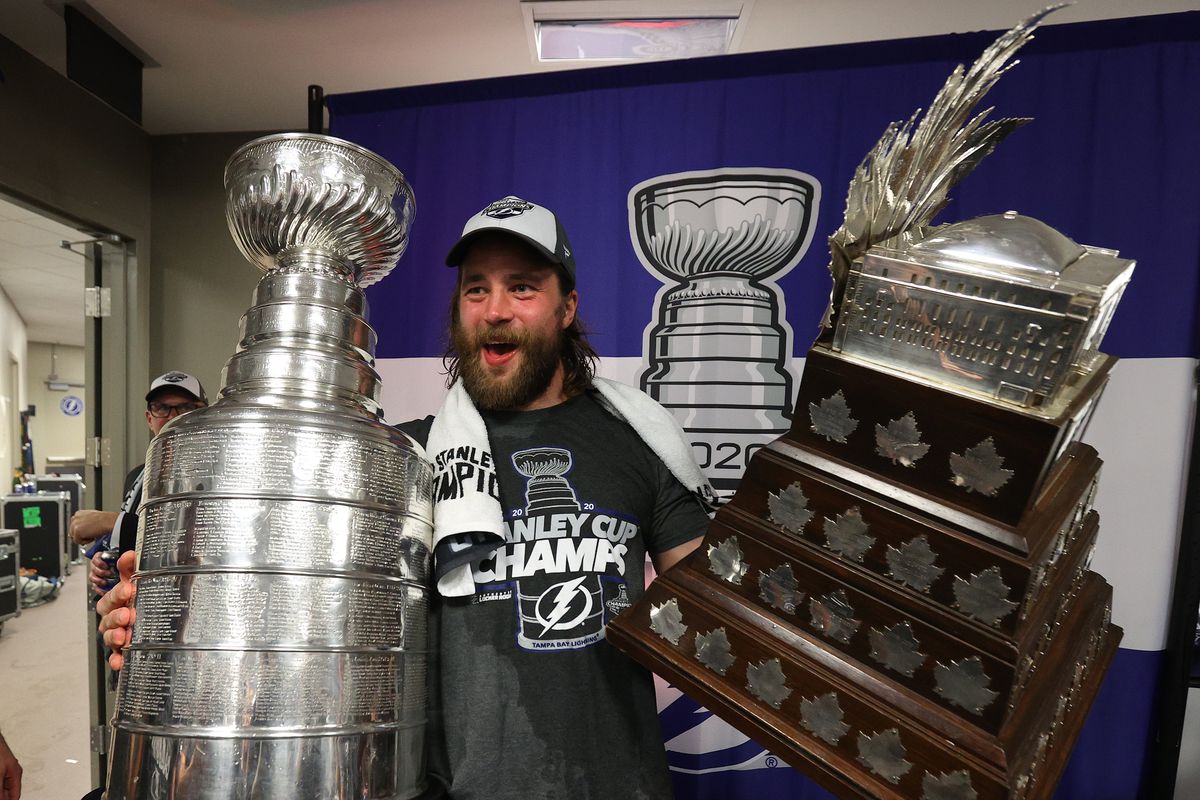 Victor Hedman of the Tampa Bay Lightning celebrates with the Stanley Cup and the Conn Smythe Trophy in the locker room after the Tampa Bay Lightning defeated the Dallas Stars 2-0 in Game Six of the NHL Stanley Cup Final to win the best of seven game series 4-2 at Rogers Place on September 28, 2020 in Edmonton, Alberta, Canada.
