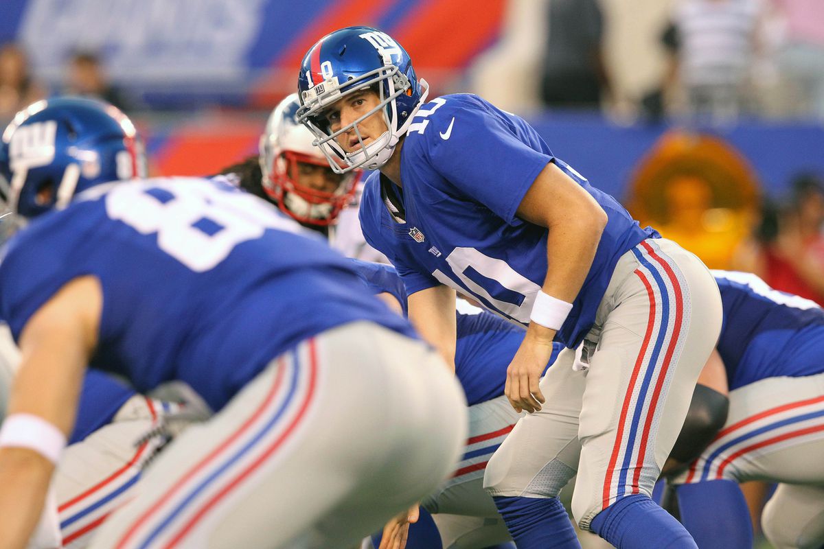 August 29, 2012; East Rutherford, NJ, USA; New York Giants quarterback Eli Manning (10) at the line during the first quarter of a preseason game against the New England Patriots at MetLife Stadium. Mandatory Credit: Brad Penner-US PRESSWIRE