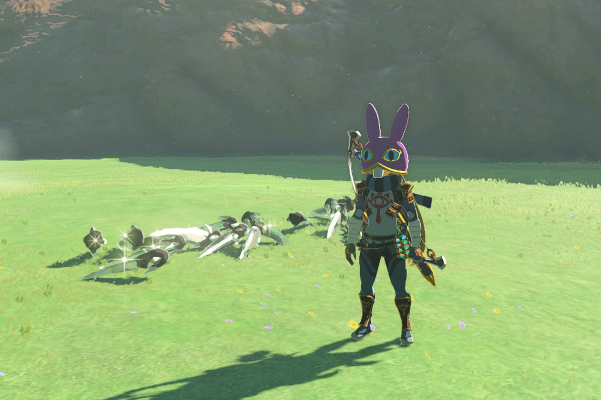 Link in a purple bunny hood in Tears of the Kingdom stands on a grassy field covered in diamonds