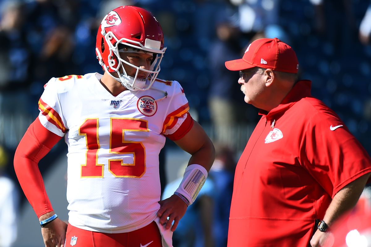 Kansas City Chiefs quarterback Patrick Mahomes talks with head coach Andy Reid before a game against the Tennessee Titans at Nissan Stadium.