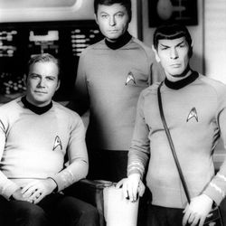William Shatner, left, DeForest Kelley, center, and Leonard Nimoy pose on the set of the television series 'Star Trek' in this undated photo. 
