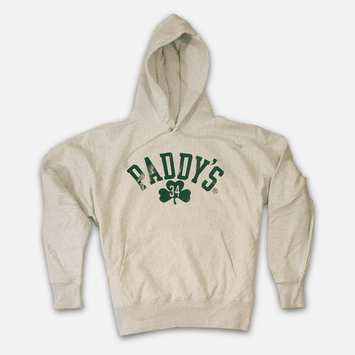 White hoodie has green shamrock and Paddy’s logo