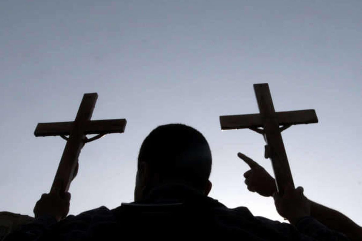 Egyptian Christians raise crosses during a protest against the military.