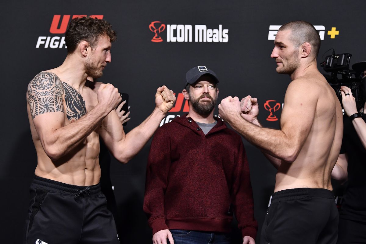 Opponents Jack Hermansson of Sweden and Sean Strickland face off during the UFC Fight Night weigh-in at UFC APEX on February 04, 2022 in Las Vegas, Nevada.