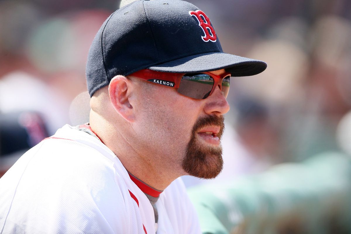 Kevin Youkilis #20 of the Boston Red Sox watches the game from the dugout at Fenway Park in Boston, Massachusetts. The Tampa Bay Rays defeated the Boston Red Sox 1-0.  (Photo by Elsa/Getty Images)