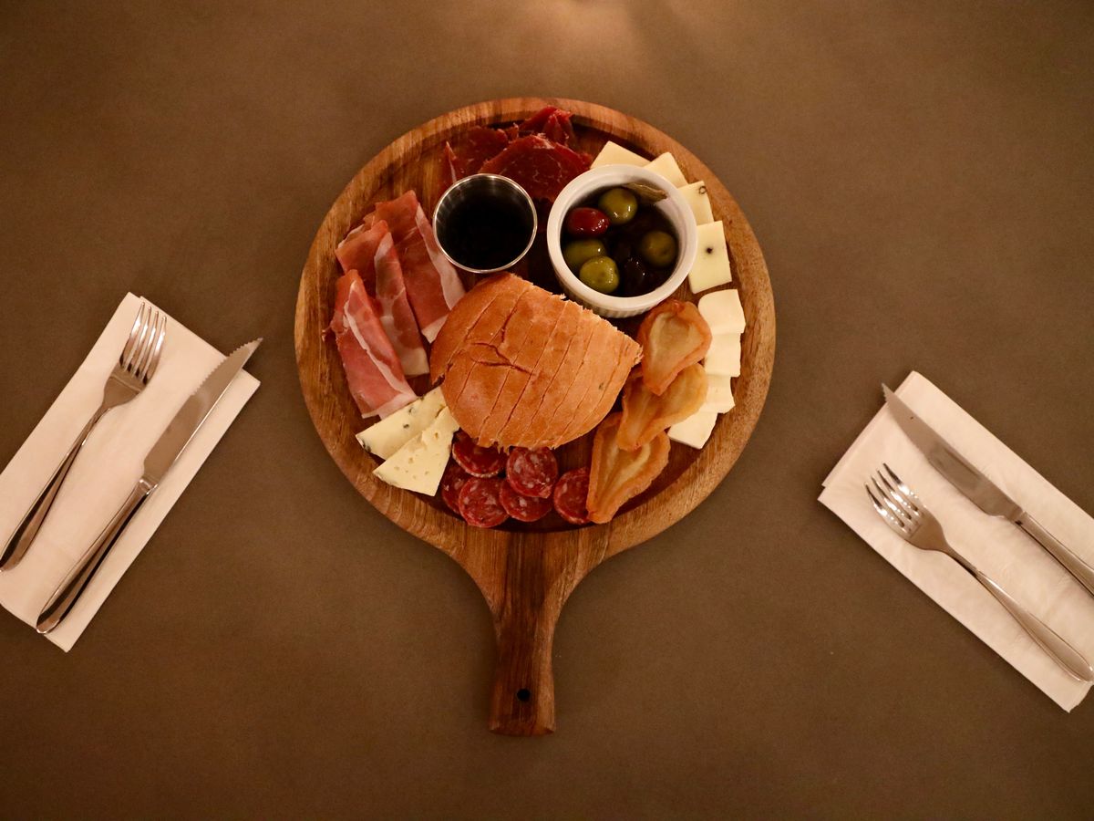 An aerial shot of a cheese and charcuterie board.