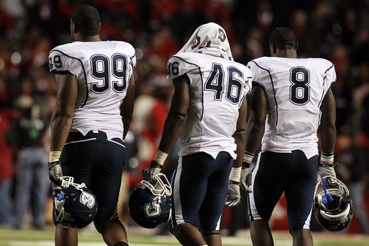 Kendall Reyes, Sio Moore and Lawrence Wilson of the Connecticut Huskies walk off the field after losing against the Rutgers. Let's not have a repeat of this image today.