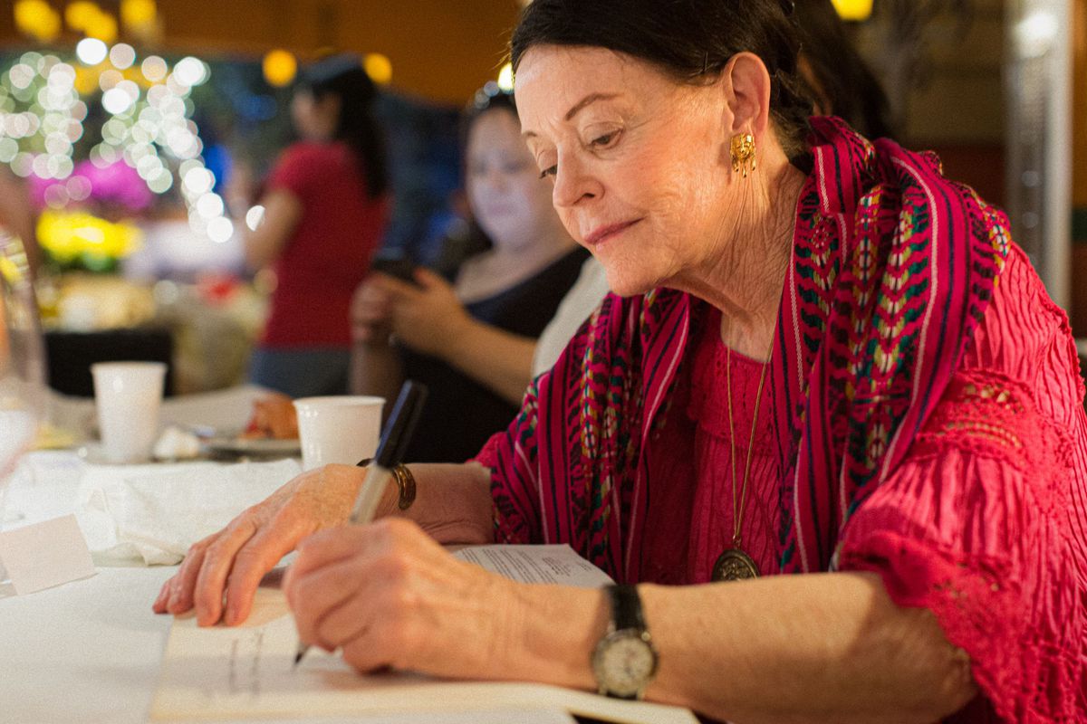 Barbara Hansen, a legendary LA Times food writer and journalist, signing her Mexican cookbook.