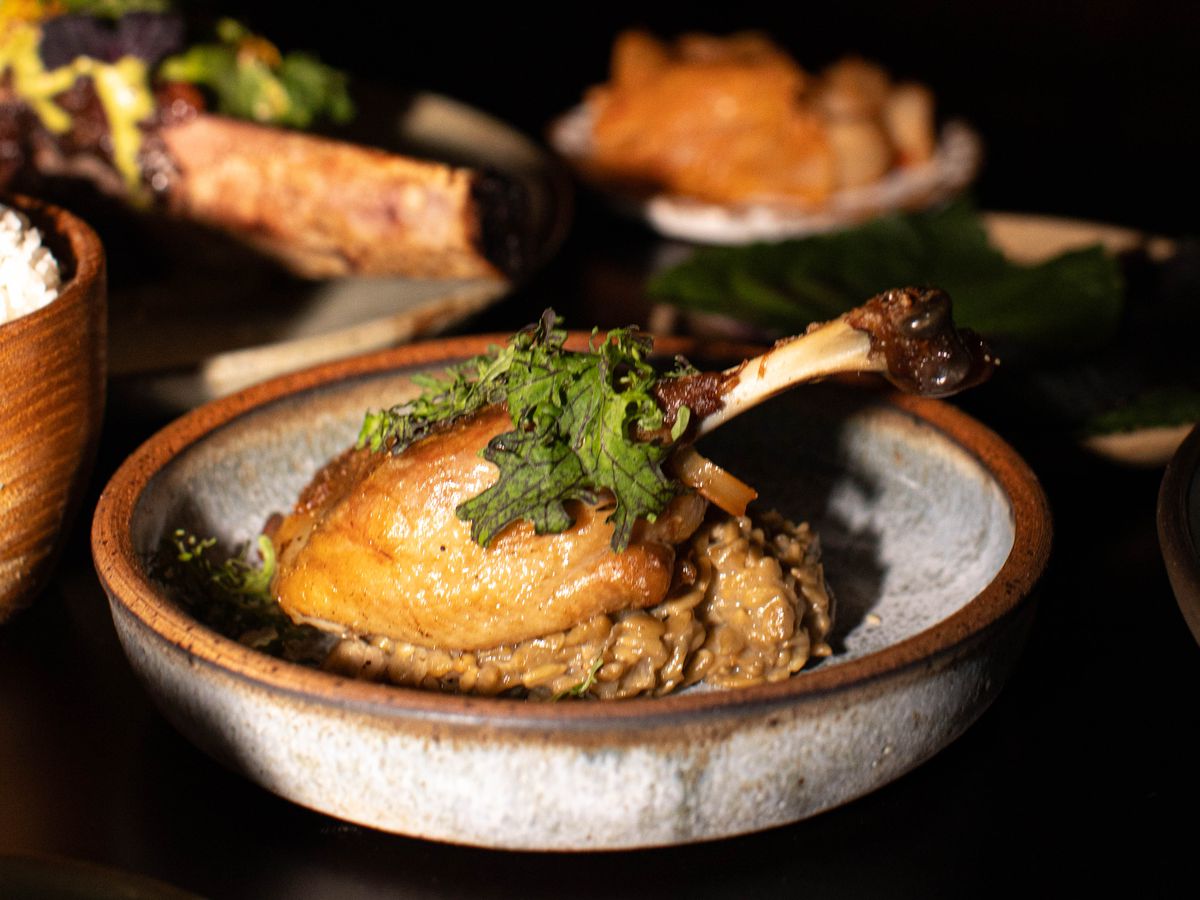 Duck confit in a stoneware bowl