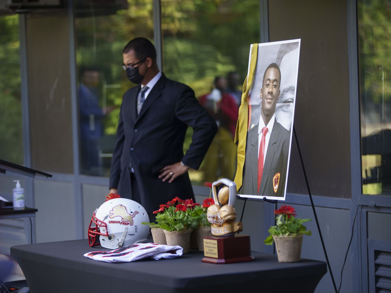 A gold tie hangs a on a photo of Rashad Verner during a memorial for Verner at Urban Prep Academy High School Bronzeville Campus at 521 E 35th St in Ida B. Wells / Darrow Homes Tuesday, Oct. 6, 2020.