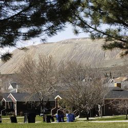Homes in  Copperton Township  Friday, April 12, 2013, with a view of Kennecott  Utah Copper's Bingham Canyon Mine.