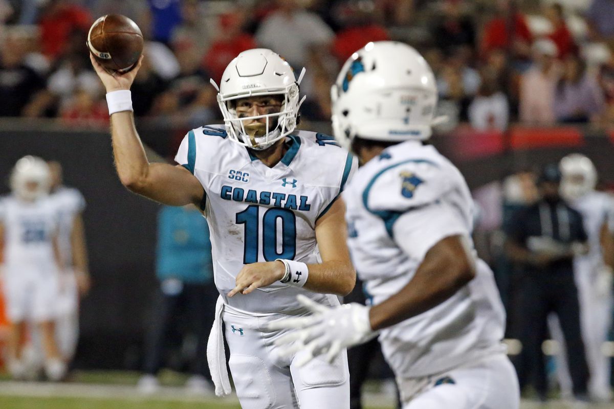 Coastal Carolina Chanticleers quarterback Grayson McCall (10) passes the ball to tight end Isaiah Likely (front) during the second half against the Arkansas State Red Wolves at Centennial Bank Stadium.