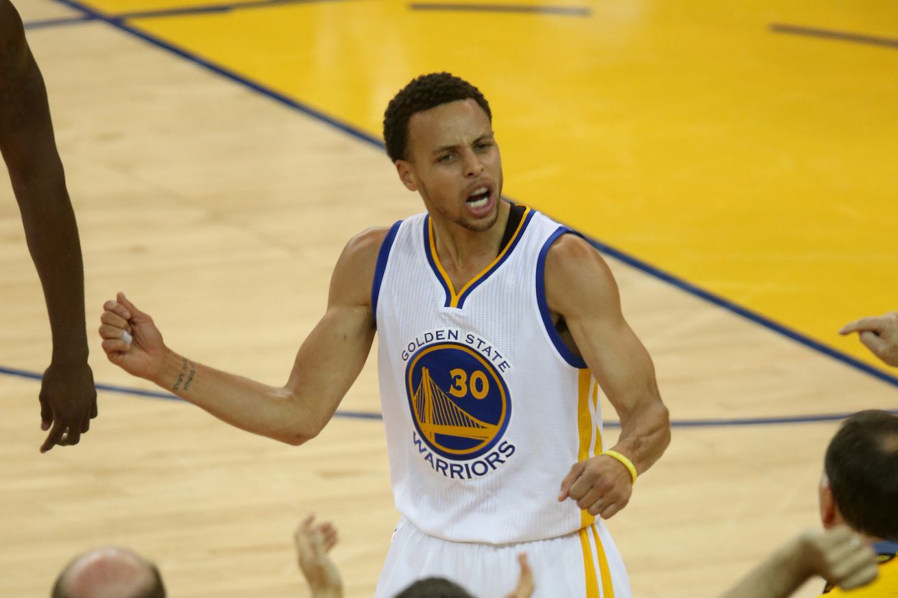 Golden State Warriors’ Stephen Curry (30) celebrates at the end of the first quarter of Game 5 of the NBA Western Conference semifinals against the Memphis Grizzlies at Oracle Arena in Oakland, Calif., on Wednesday, May 13, 2015. (Jane Tyska/Bay Area News