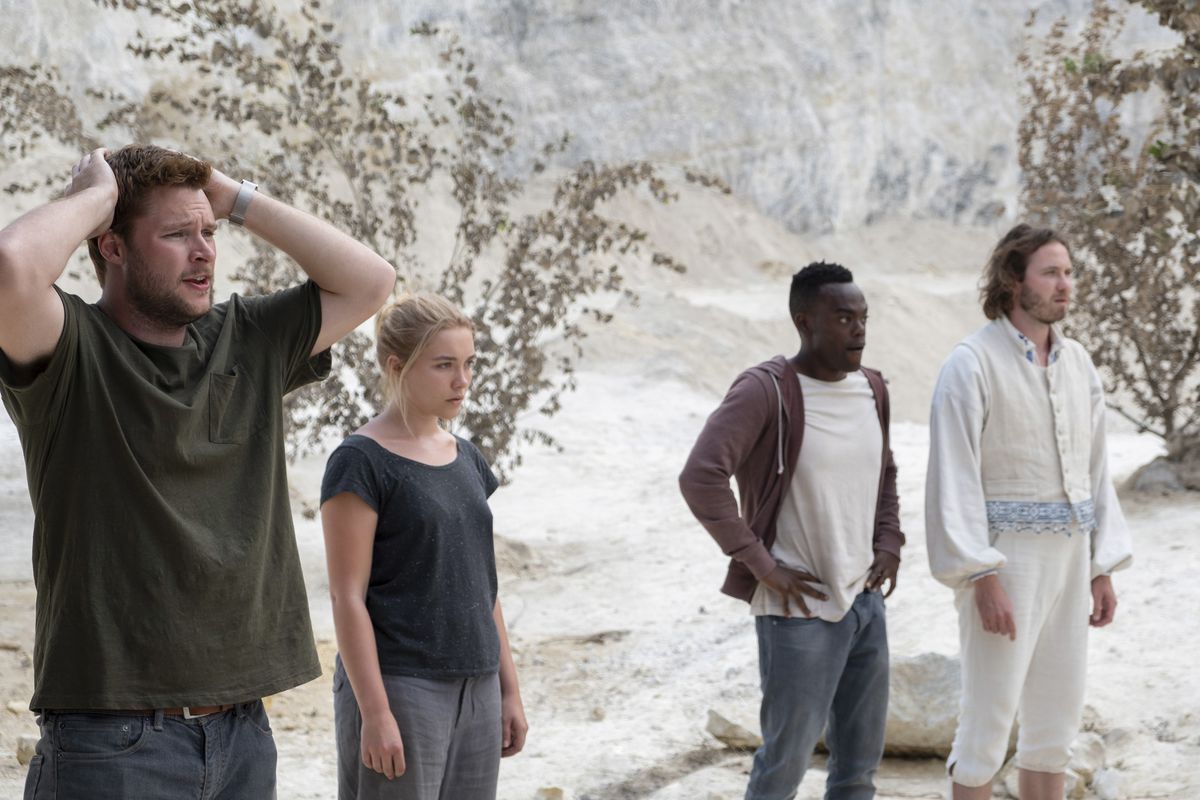 Christian (Reynor), Dani (Pugh), Josh (William Jackson Harper), and Pelle (Vilhelm Blomgren) watching a ritual unfold.