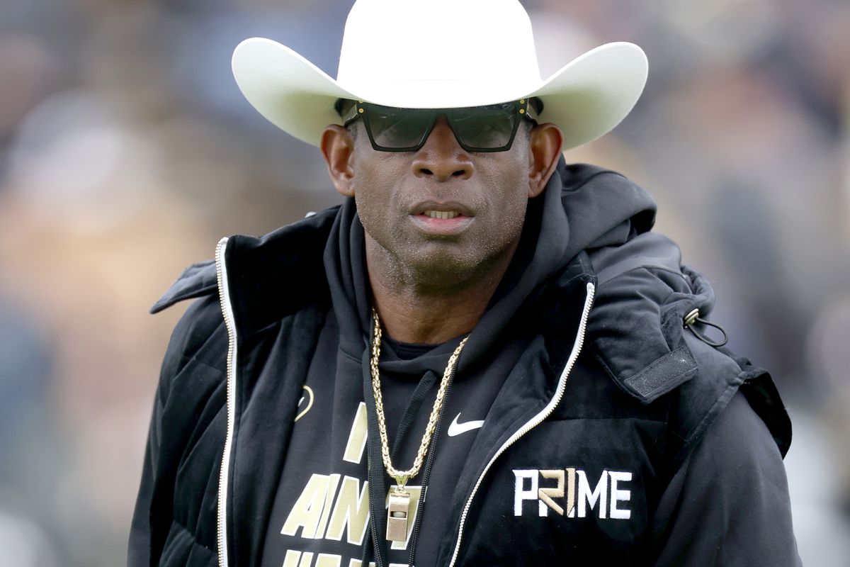 Head coach Deion Sanders of the Colorado Buffaloes watches as his team warms up prior to their spring game at Folsom Field on April 22, 2023 in Boulder, Colorado.