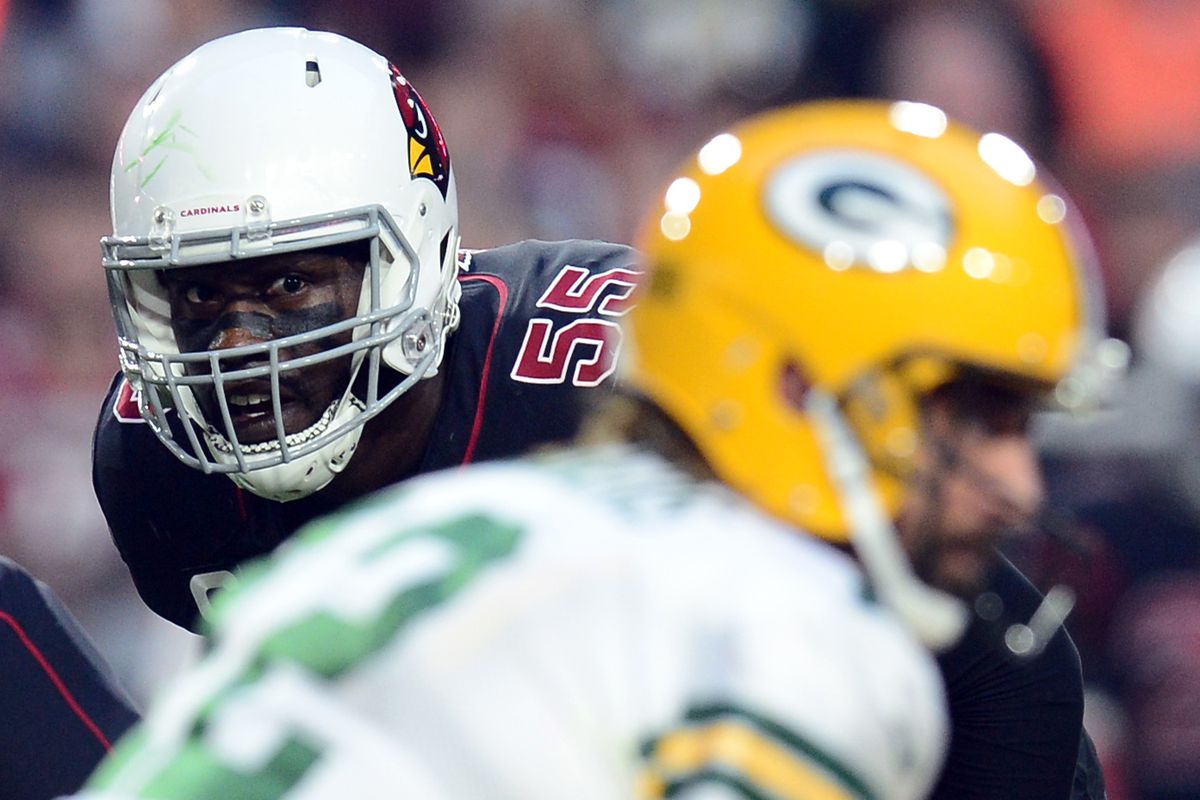 Arizona Cardinals linebacker Chandler Jones (55) looks across the line at Green Bay Packers quarterback Aaron Rodgers (12) during the first half at State Farm Stadium.&nbsp;