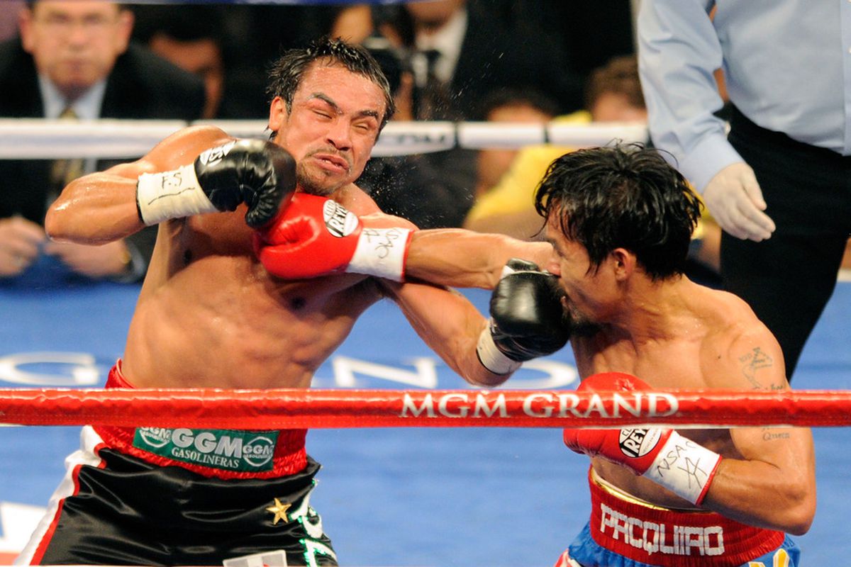 Manny Pacquiao and Juan Manuel Marquez had a great, close fight on Saturday. Apparently, that's too much for some to accept. (Photo by Ethan Miller/Getty Images)