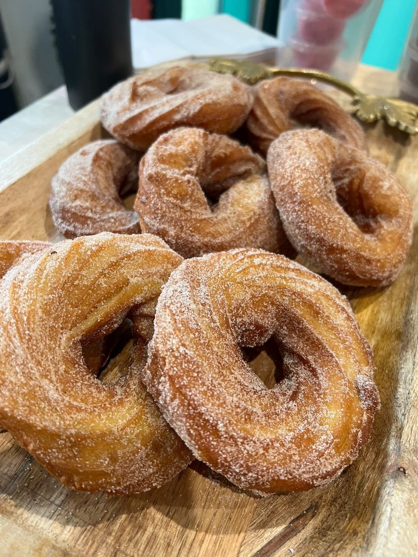 A photo of a plate of doughnuts.
