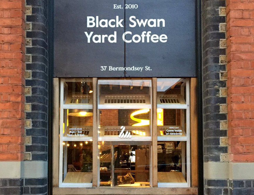 The exterior of Black Swan Coffee, with a hatch for serving coffee and buns.