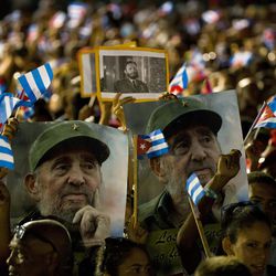 People wait for the start of a memorial honoring the late Fidel Castro at Plaza Antonio Maceo in Santiago, Cuba, Saturday, Dec. 3, 2016. After a four-day journey across the country through small towns and cities where his rebel army fought its way to power nearly 60 years ago, Castro's remains arrived to Santiago for burial. 
