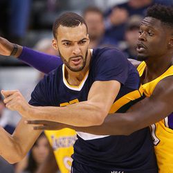 Utah Jazz center Rudy Gobert (27) is defended by Los Angeles Lakers forward Julius Randle (30) as the Utah Jazz open the home season with the LA Lakers in Salt Lake City on Friday, Oct. 28, 2016. 