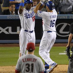 Los Angeles Dodgers' Andre Ethier, right, is congratulated by Yasiel Puig after hitting a two-run home run as Arizona Diamondbacks starting pitcher Ian Kennedy looks on during the sixth inning of their baseball game, Tuesday, June 11, 2013, in Los Angeles.  