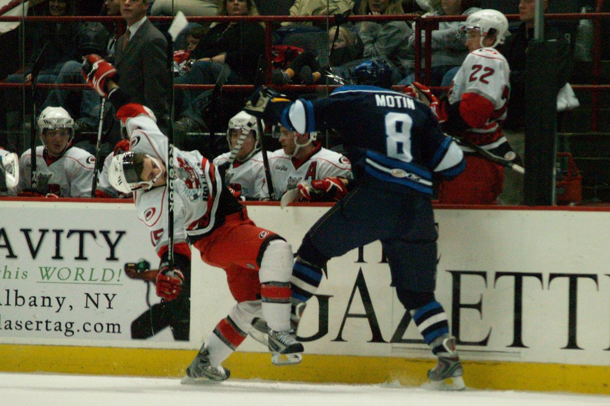 Johan Motin lowers the boom on Stefan Chaput in a game against the Albany River Rats on October 30, 2009, in Albany. Photo by Jennifer Bock.