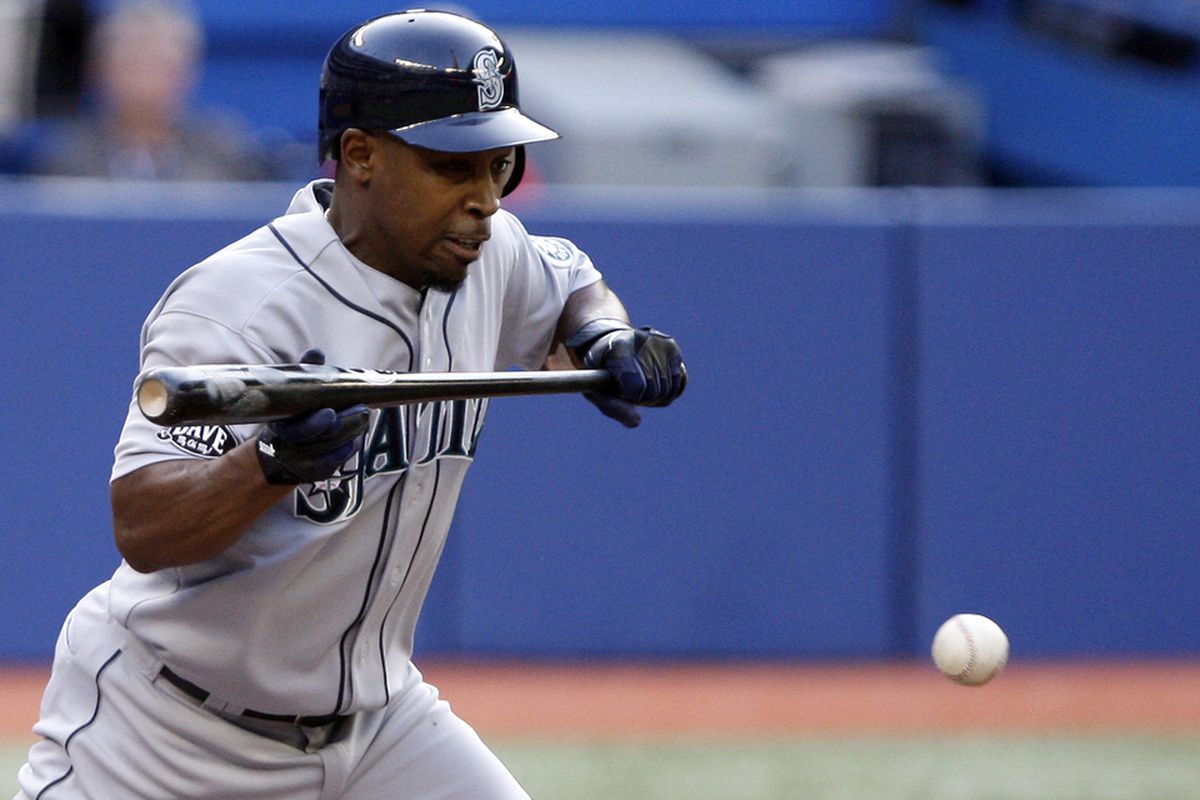 TORONTO, CANADA - JULY 19: Chone Figgins #9 of the Seattle Mariners bunts against the Toronto Blue Jays during MLB action at The Rogers Centre July 19, 2011 in Toronto, Ontario, Canada. (Photo by Abelimages/Getty Images)