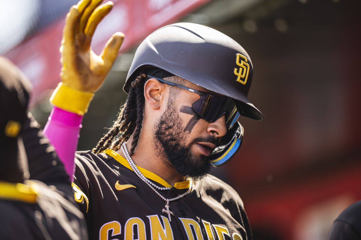 Fernando Tatis Jr. of the San Diego Padres celebrates in the dugout during a spring training game against the Los Angeles Angels on March 24, 2023 at the Tempe Diablo Stadium in Tempe, Arizona.
