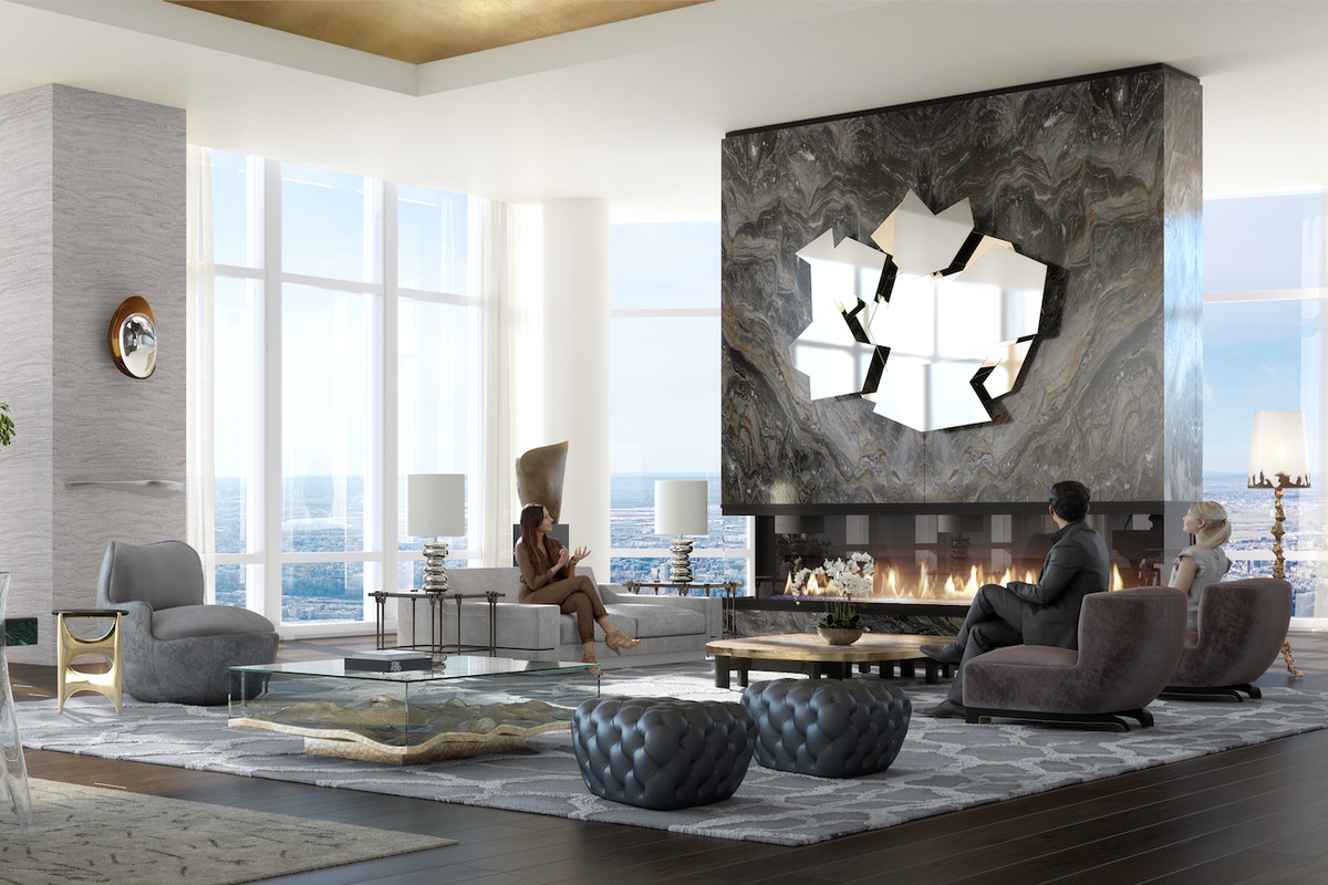 A penthouse in a skyscraper showing floor-to-ceiling windows, views of the Manhattan skyline, a fireplace, a rectangular dining table and a living area with several couches on the right side.