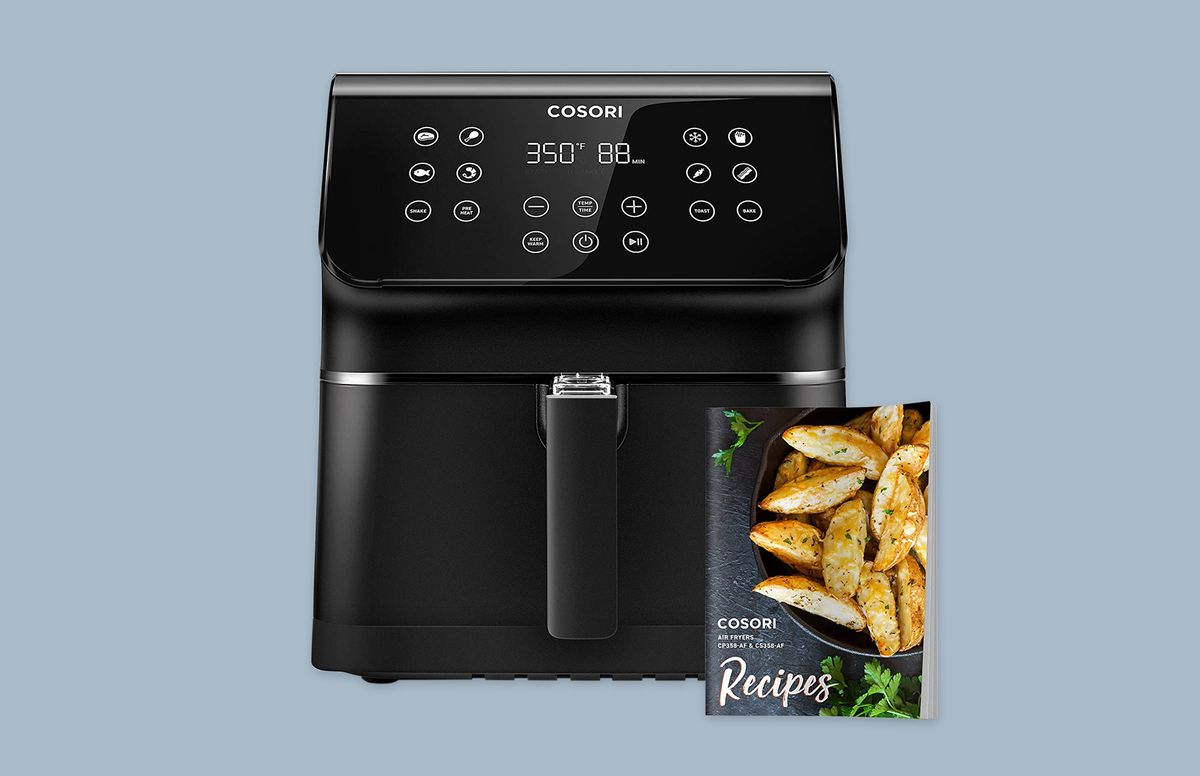 COSORI Pro Air Fryer Oven Combo with cookbook on blue background